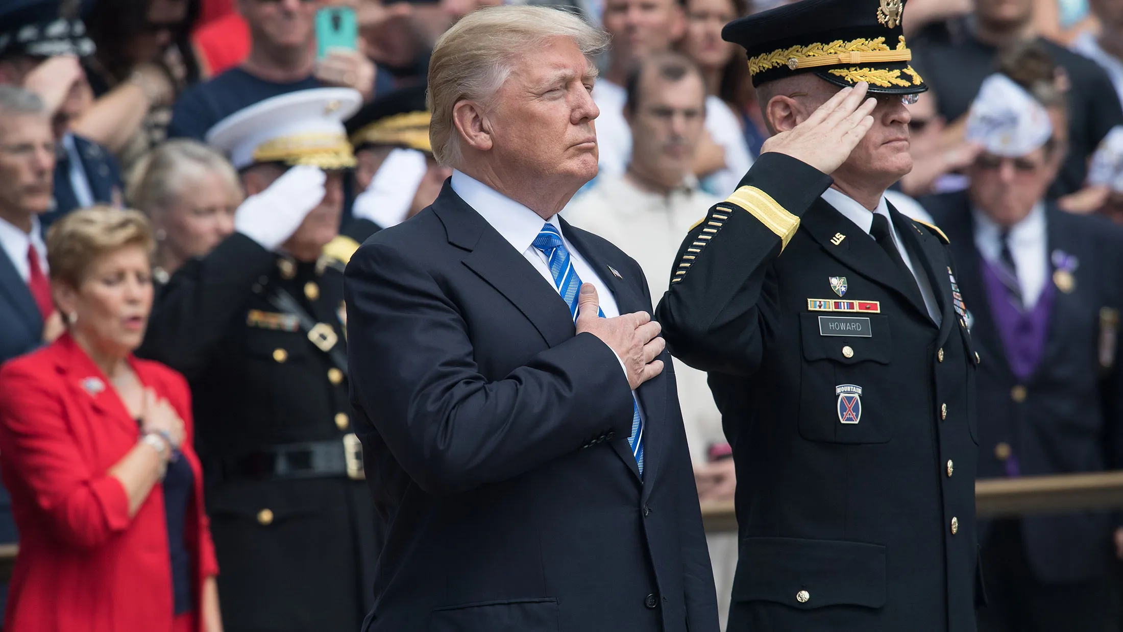 Donald Trump listens to the national anthem before laying a wreath at the Tomb of the Unknowns at Arlington National Cemetery in Virginia on May 29, 2017.
