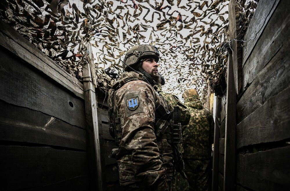 Ukrainian troops patrol outside the town of Novoluhanske, eastern Ukraine, on Feb. 19.
