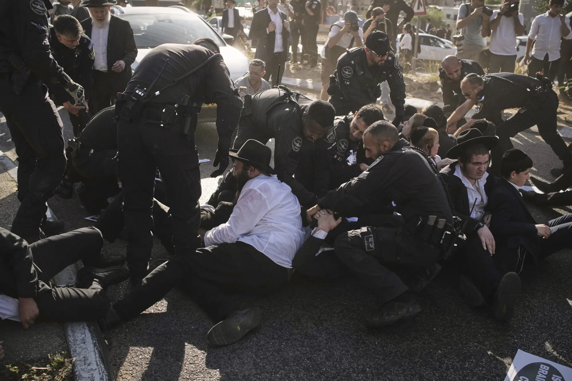 Police disperse ultra-Orthodox Jewish men during a protest against army recruitment in Bnei Brak, Israel, on June 5.