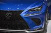 A Toyota Motor Corp. Lexus badge is seen on the front grille of a NX compact crossover vehicle.