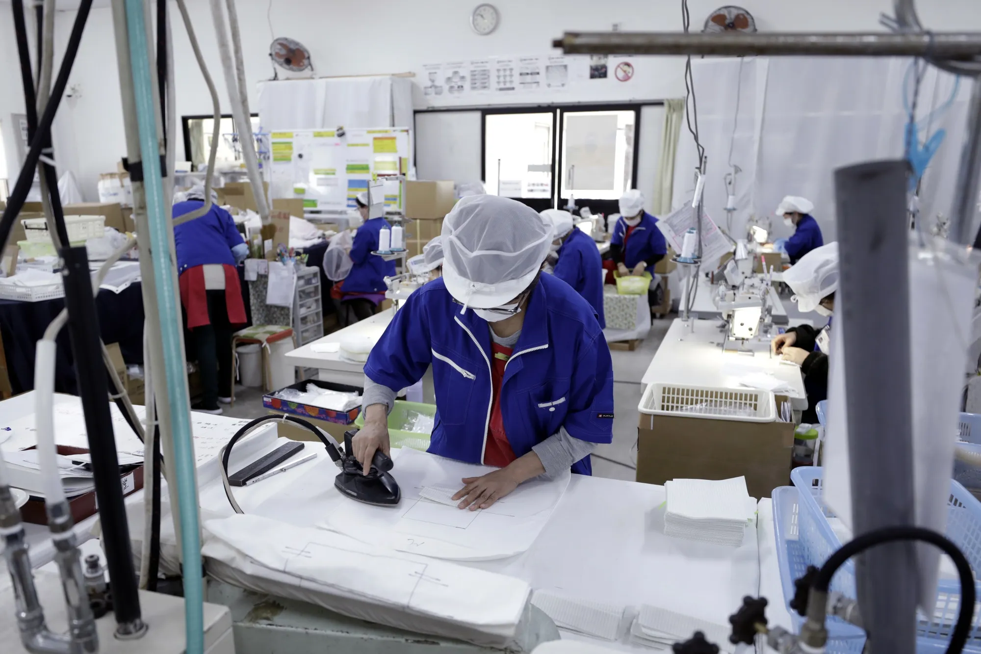 Protective mask production in Toyohashi.&nbsp;Producers of surgical masks and gowns are also receiving funding.