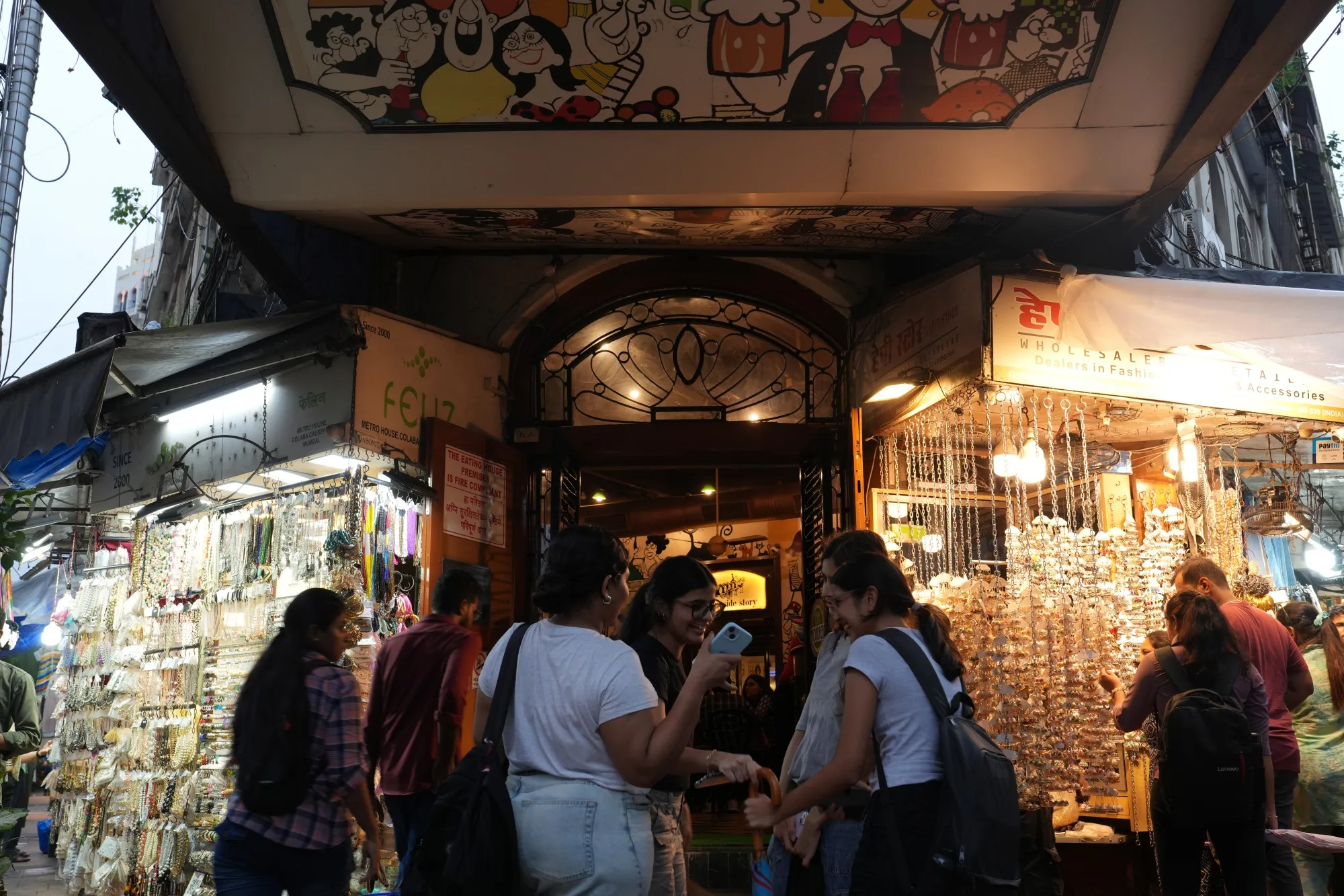 Customers look a accessories at street stalls in Mumbai, India.