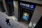 A pedestrian walks past a JPMorgan Chase &amp; Co. bank branch in Chicago, Illinois.