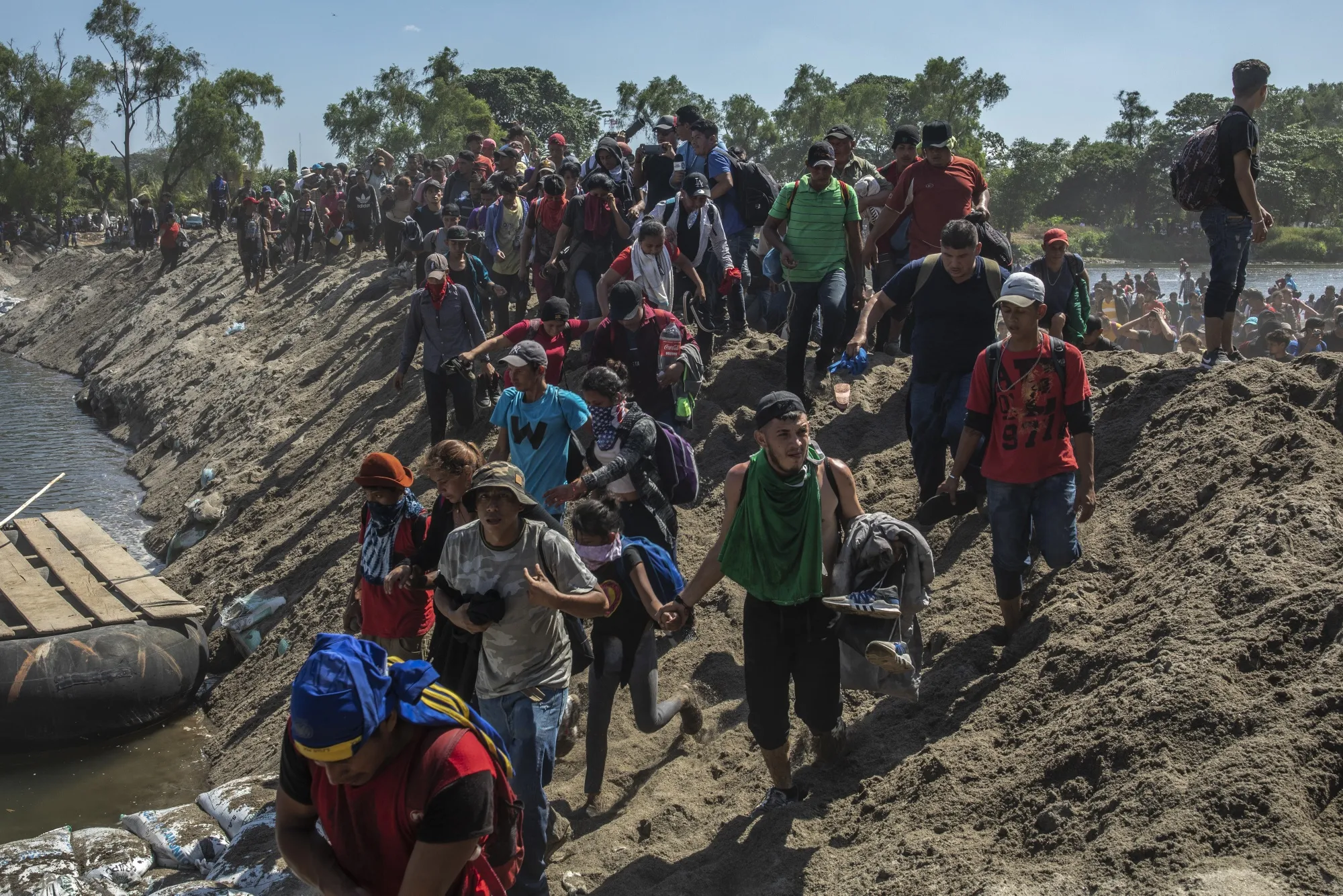 Central American migrants arrive in Mexico after crossing the Suchiate River on Jan. 20.