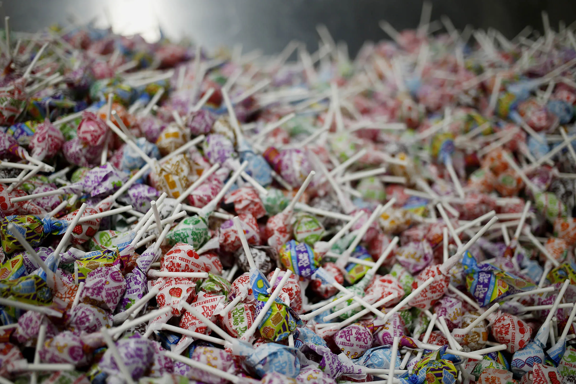 Lollipops move along a conveyor belt before being boxed and shipped in Ohio.
