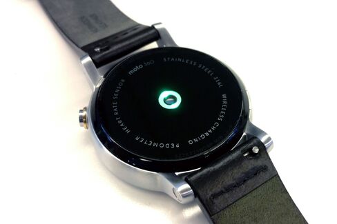 The green light is the heart rate sensor at work on the watch's rear.