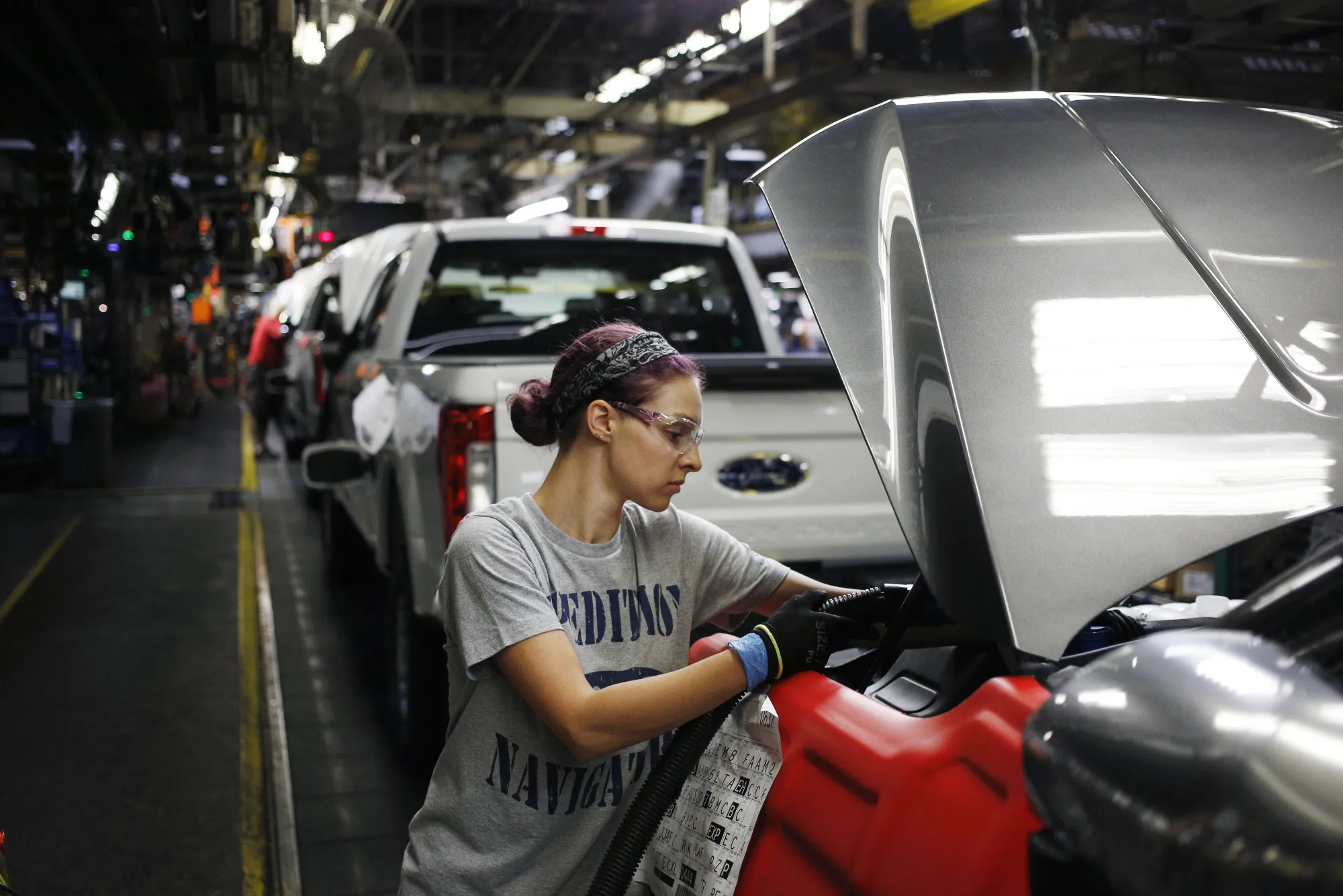 An employee works on a Ford Motor Co. Expedition SUV on the assembly line at the Ford Kentucky Truck Plant in Louisville, Kentucky.