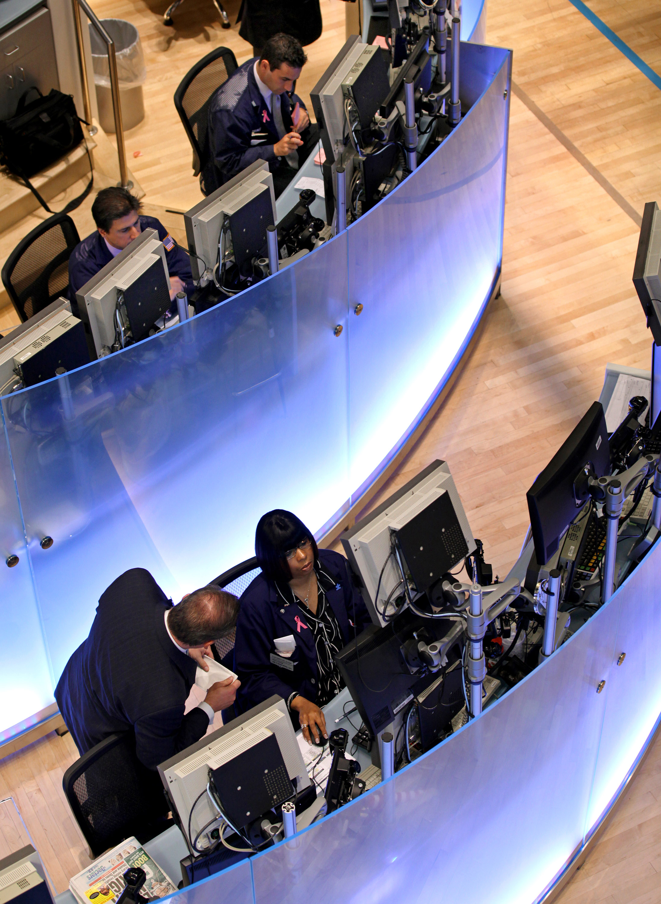 Traders work on the floor of the New York Stock Exchange in New York.
