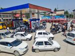 Vehicles wait in line at a gas station in Srinagar, earlier in June. 