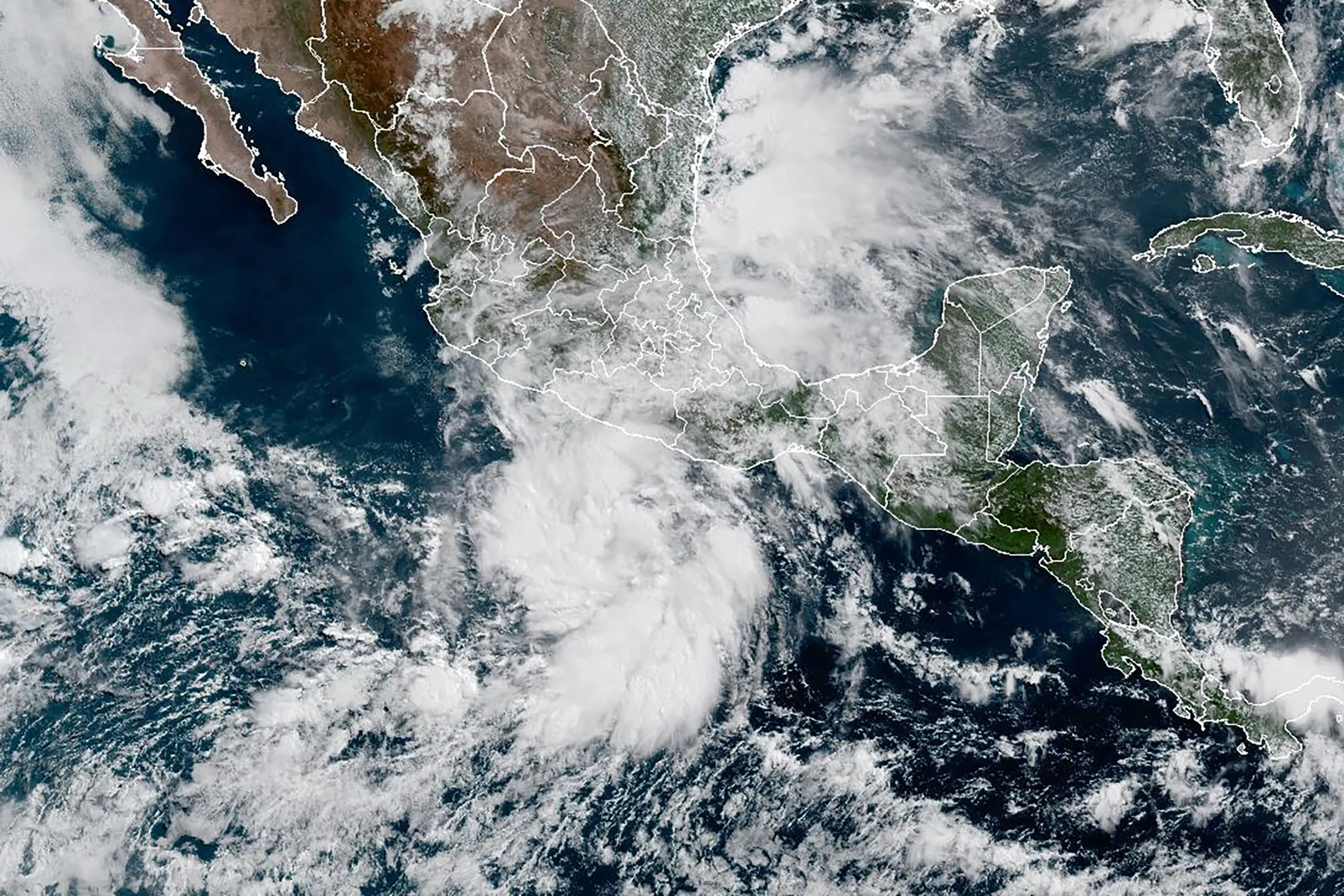 Tropical storms spinning on both of Mexico’s coasts on June 29.