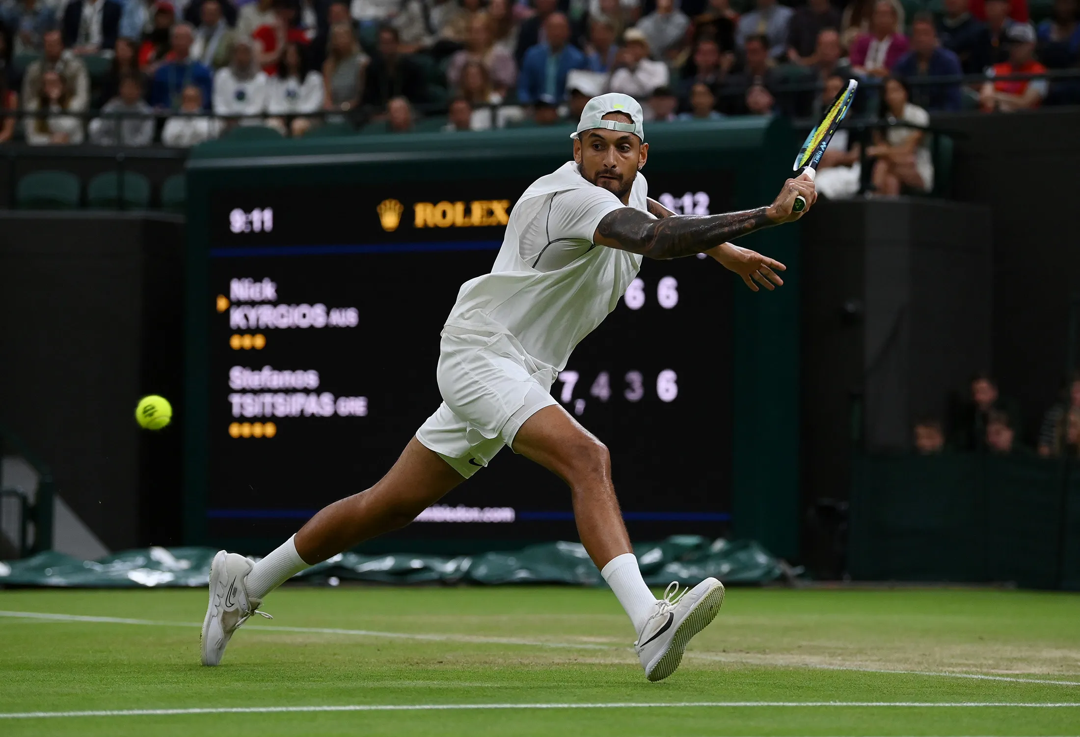 Nick Kyrgios plays a backhand against Stefanos Tsitsipas during&nbsp;The Championships Wimbledon 2022 at All England Lawn Tennis and Croquet Club in London, England, on July 2.