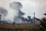 Smoke rises over the site of an explosion at a Russian&nbsp;ammunition depot near the village of Mayskoye, Crimea, on Aug. 16.
