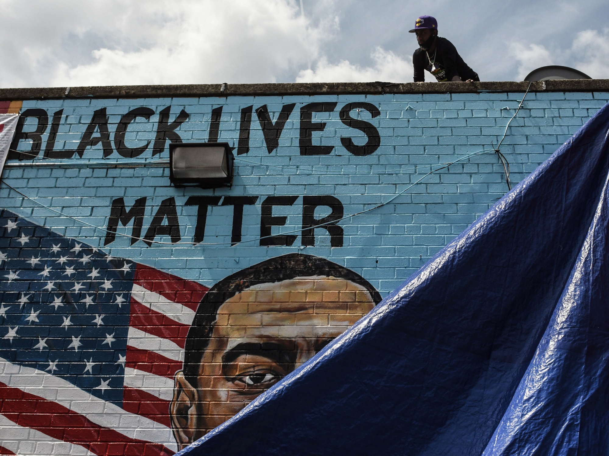A mural painted by artist Kenny Altidor depicting George Floyd unveiled in Brooklyn in July.&nbsp;