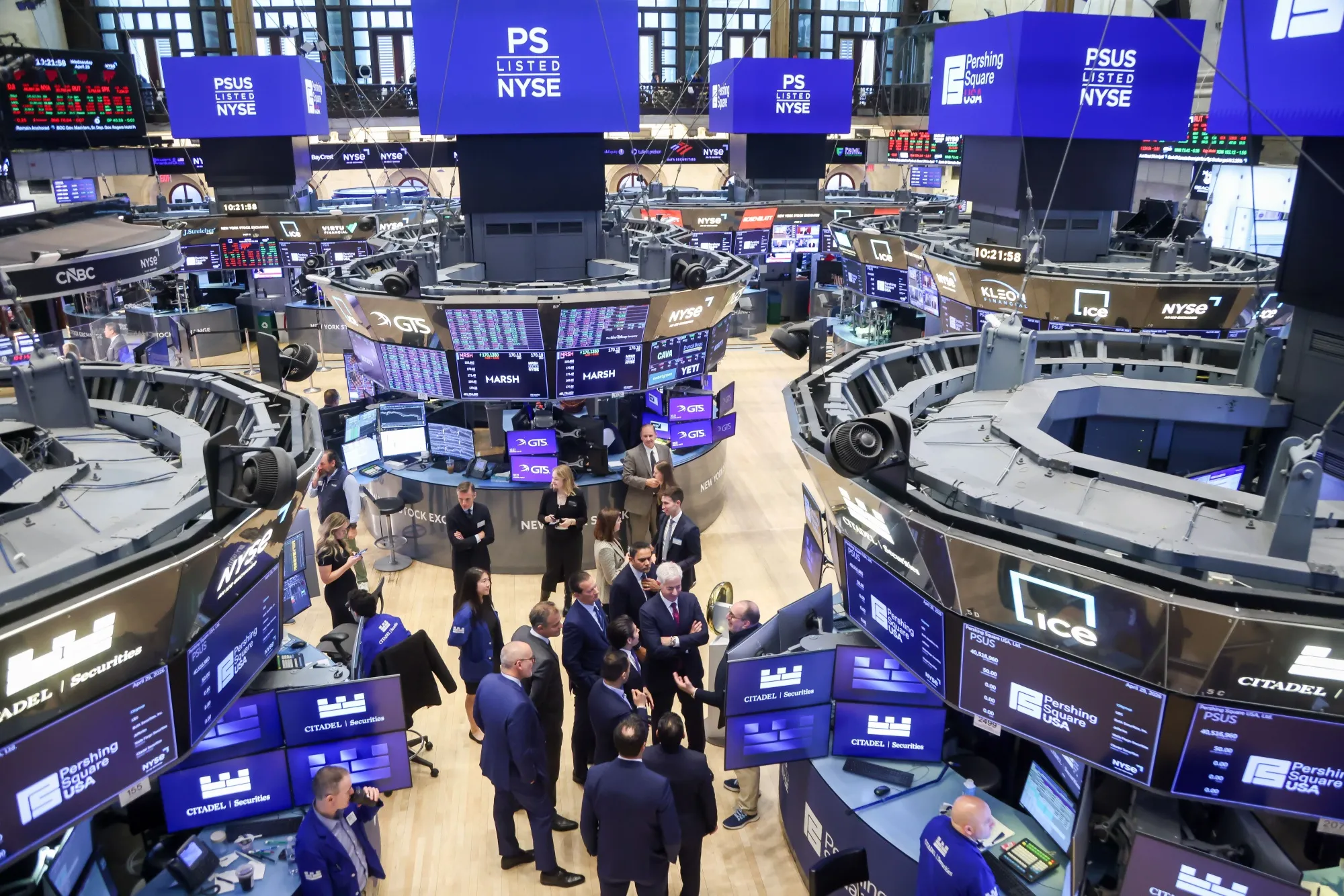 Bill Ackman, chief executive officer of Pershing Square Capital Management LP, center, during the company's initial public offering (IPO) on the floor of the New York Stock Exchange (NYSE) in New York on April 29.