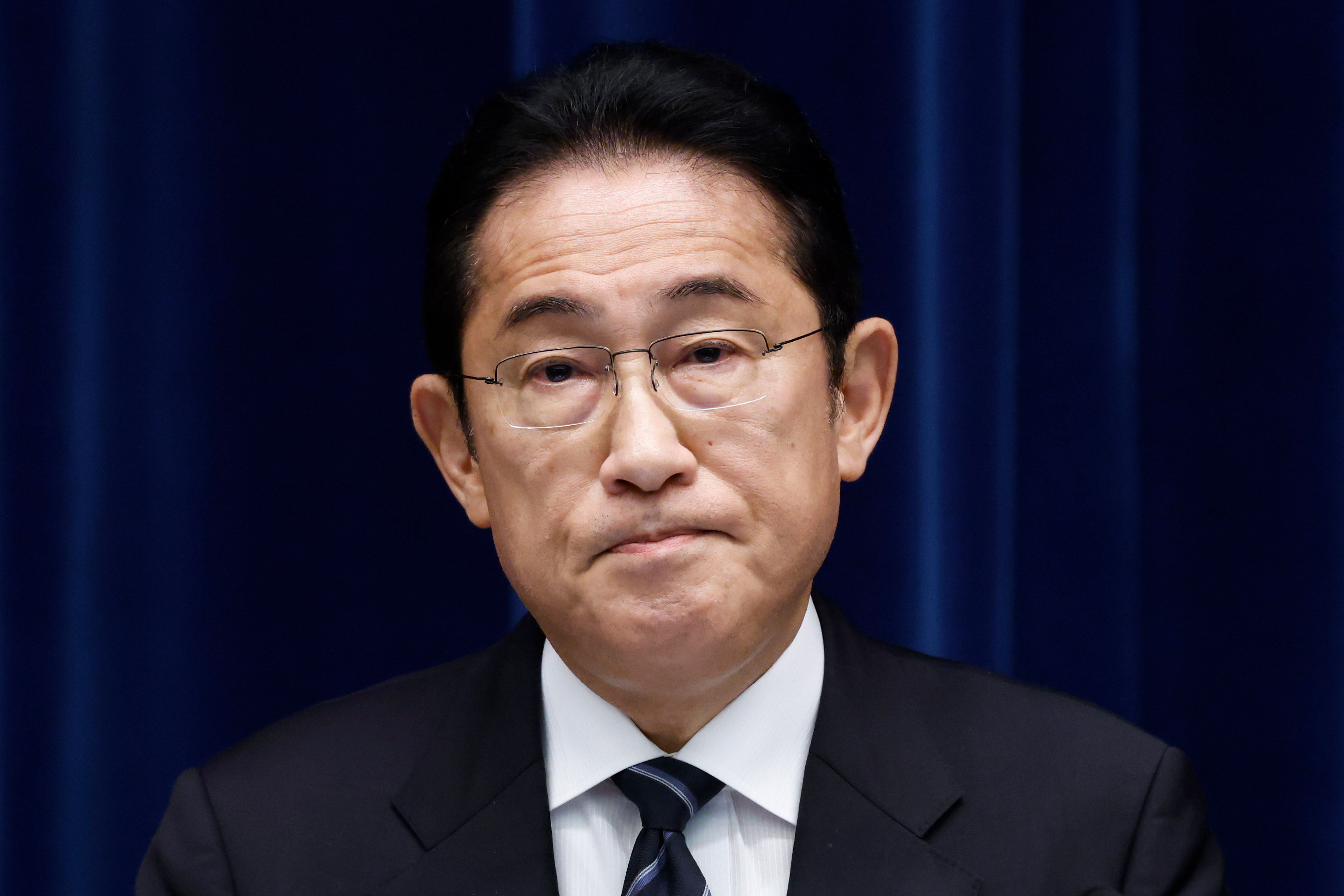 TOKYO, Japan - Go Egami (L), new president of the Incubator Bank of Japan,  shows a stern look during a news conference at the Bank of Japan's  headquarters in Tokyo on July