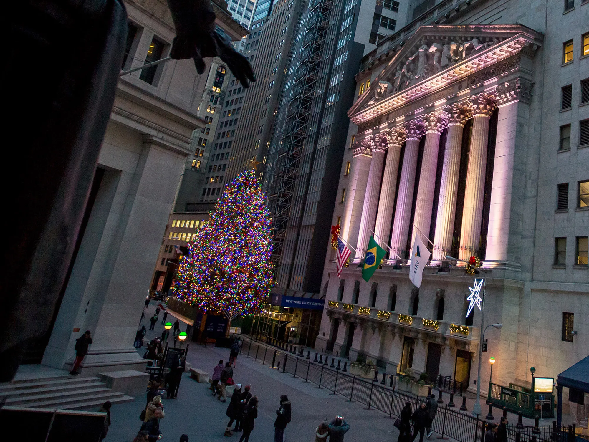 The New York Stock Exchange stands illuminated at night in New York.