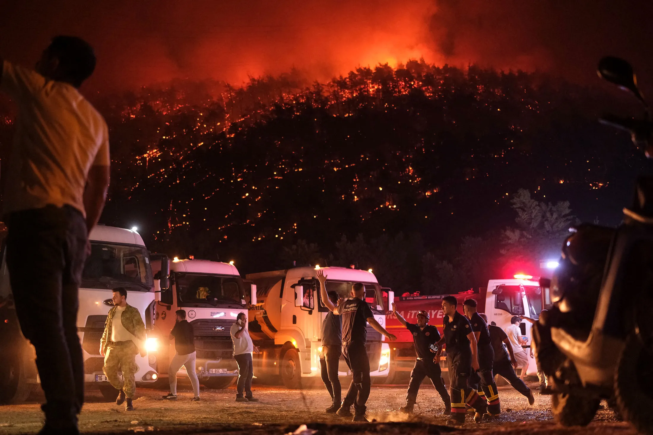 Firefighters tackle a wildfire in Gursu district, Turkey, on July 27.