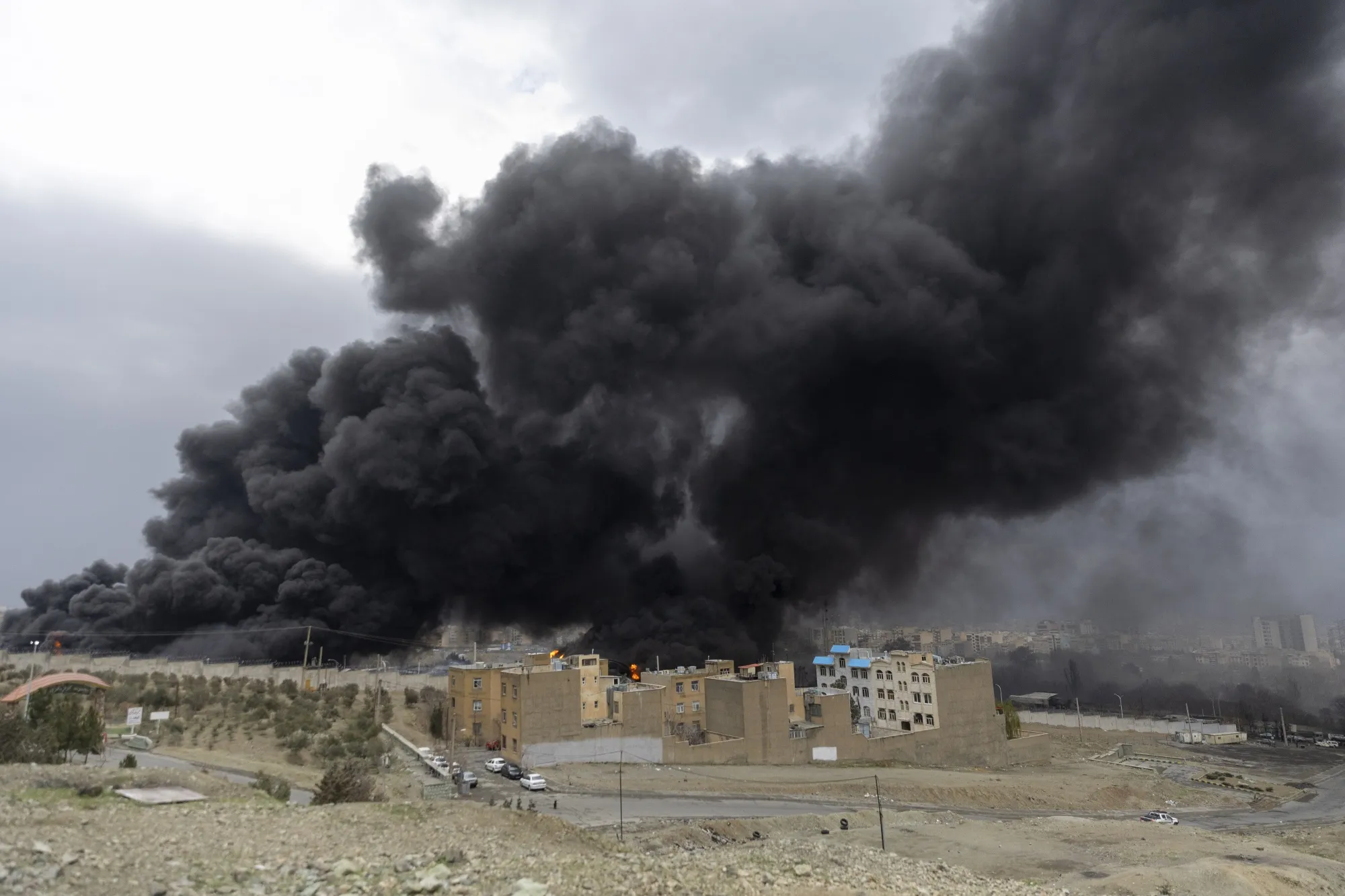 Smoke billows after airstrikes on oil depots in Tehran on March 8.