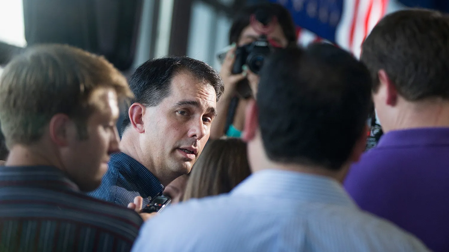 Republican presidential hopeful Wisconsin Governor Scott Walker greets guests gathered for a campaign event at Modern Woodman Park on July 17, 2015 in Davenport, Iowa
