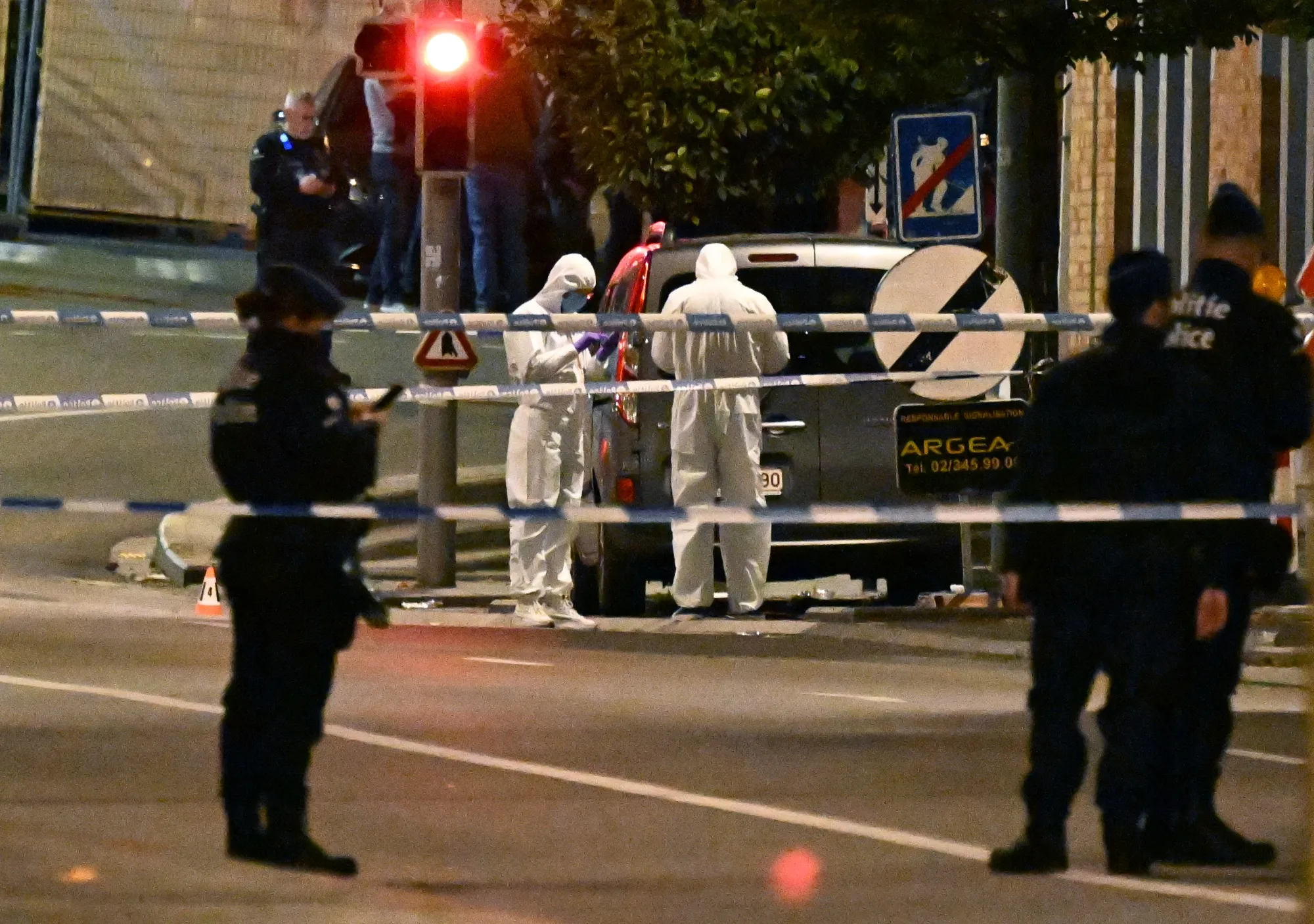 Police cordon off the area around the King Baudouin Stadium after a gunman killed two in Brussels on Oct. 17.