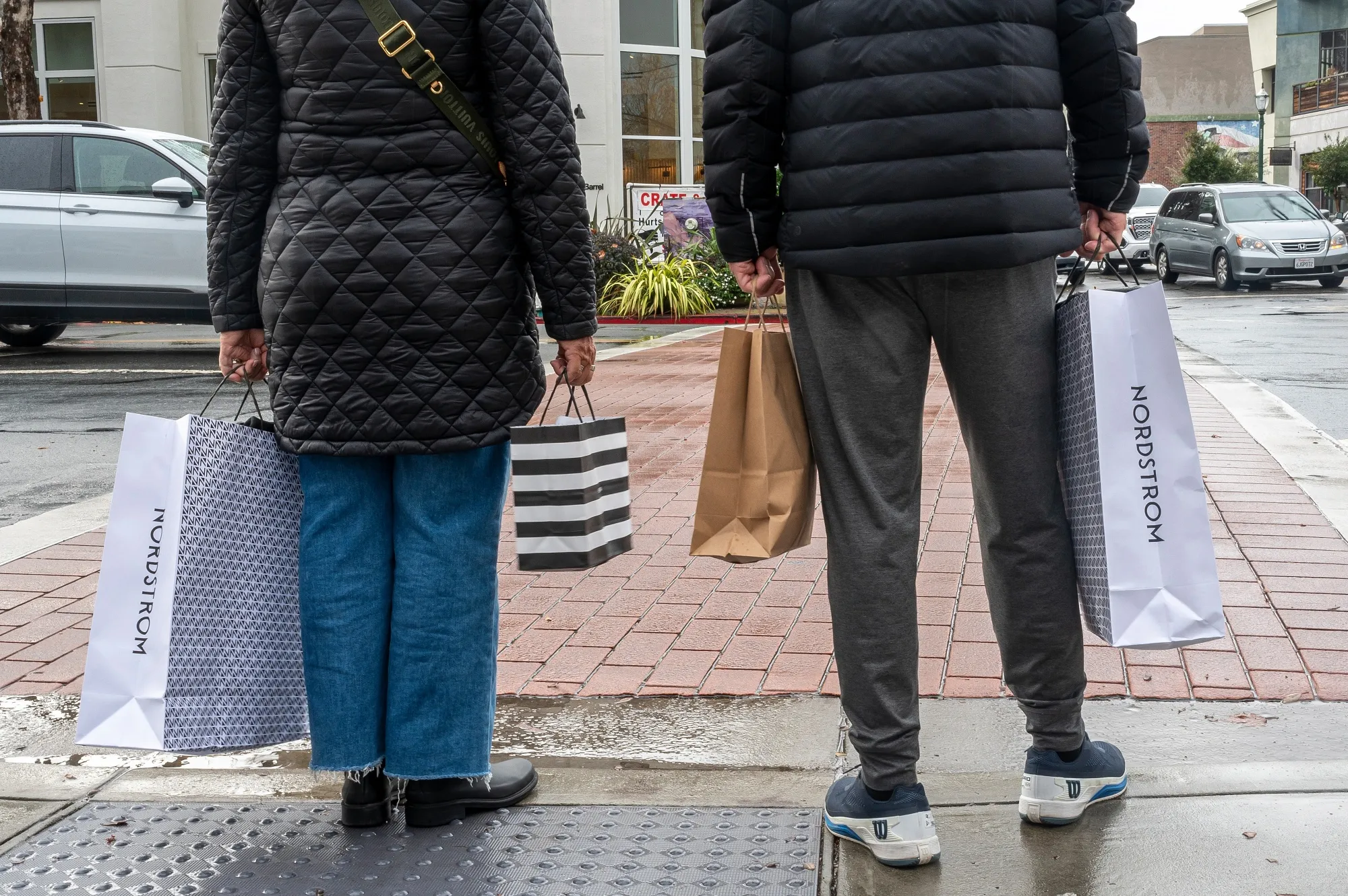 Shoppers carry bags in Walnut Creek, California.