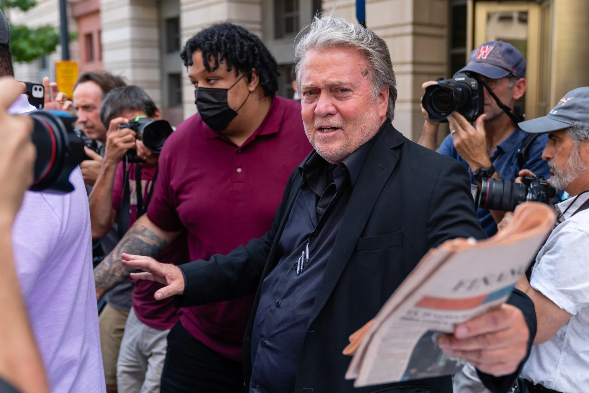Steve Bannon responds to a question while exiting federal court in Washington, D.C., on July 22.