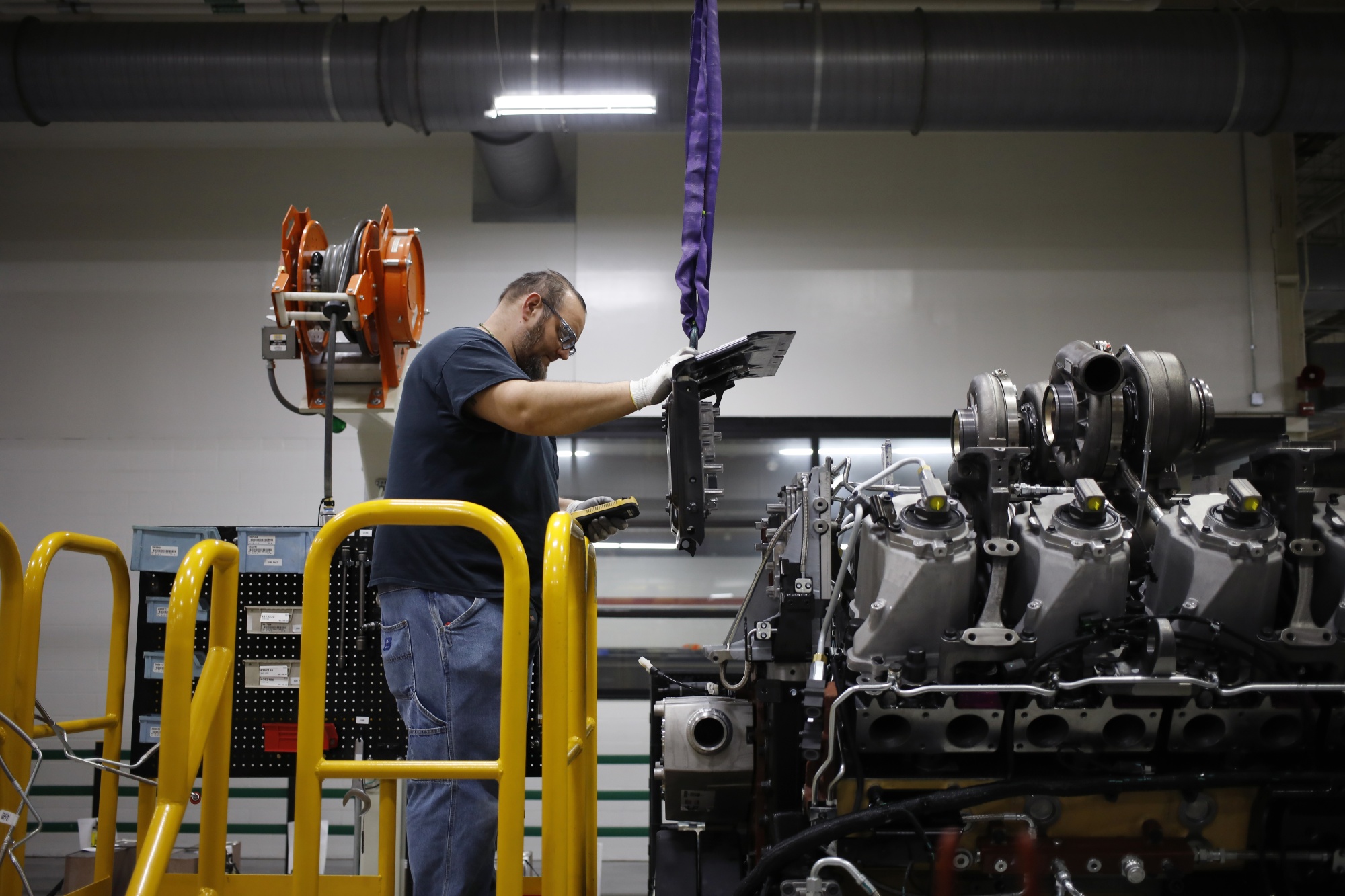 A worker assembles components on a diesel engine at a plant&nbsp;in Seymour, Indiana.