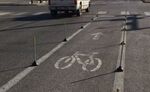 relates to A New Twist in Guerrilla Bike Lanes: Toilet Plungers