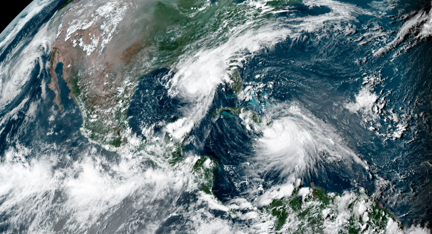 Tropical storms Marco, left, and Laura on Aug. 23.