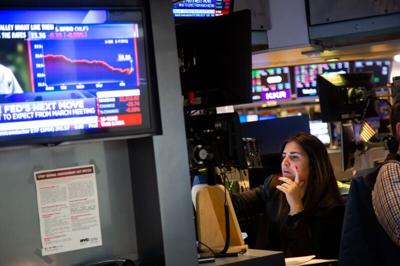 A trader on the floor of the New York Stock Exchange in New York, US, on Friday, March 10, 2023.