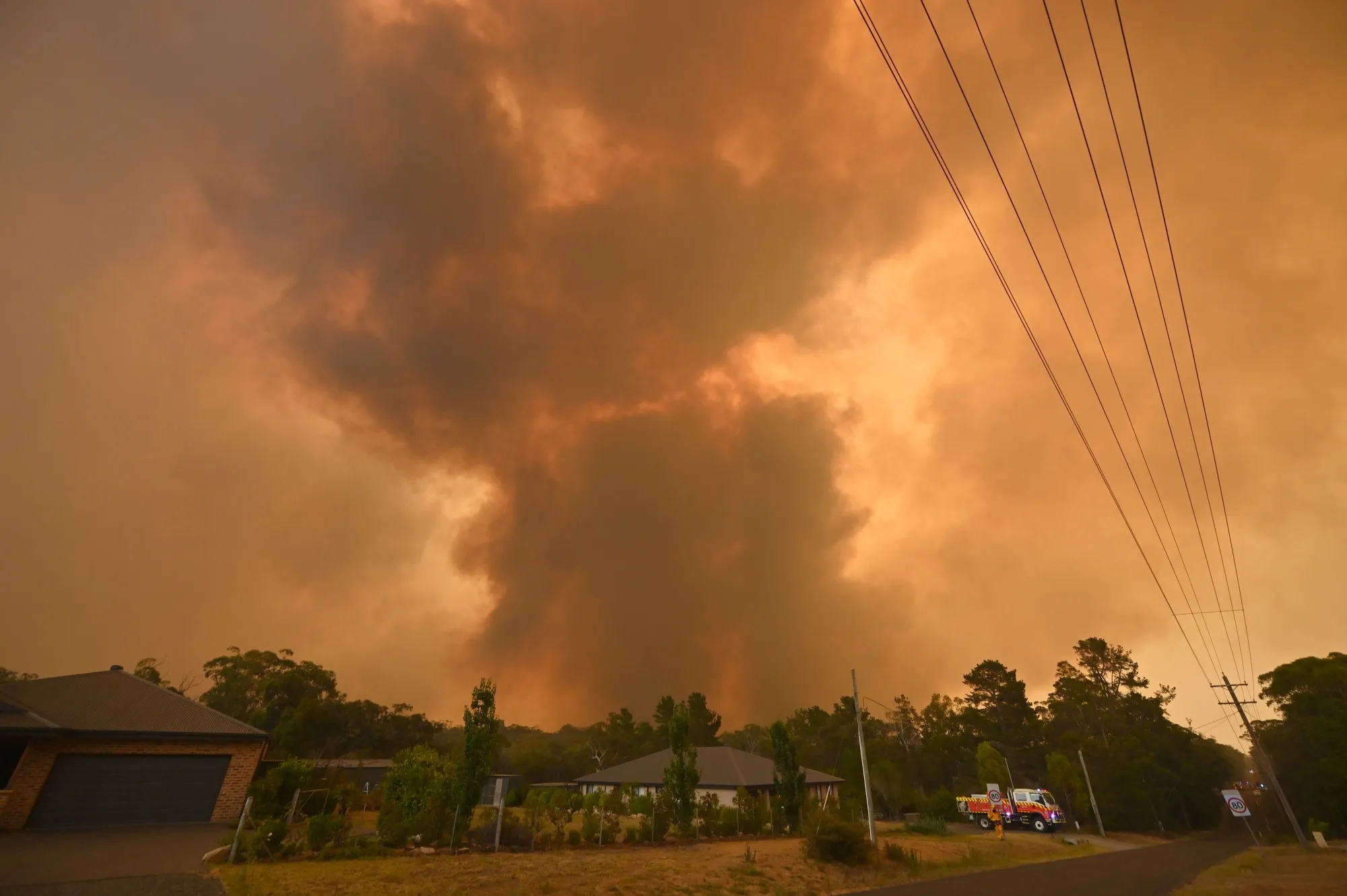 A large bushfire burns near houses in Bargo on Dec. 21.