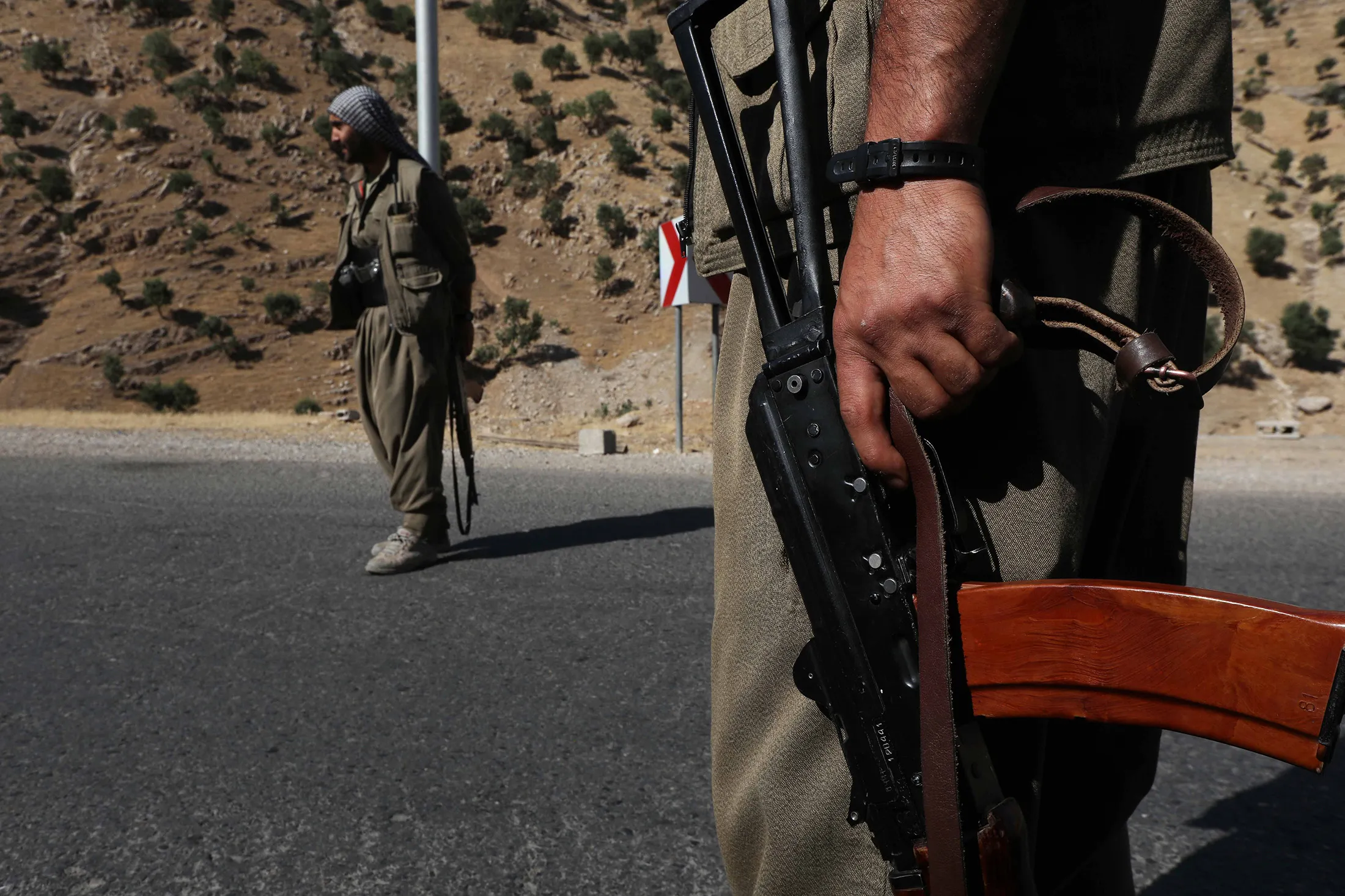 A member of the Kurdistan Workers' Party (PKK) carries an automatic rifle in Northern Iraq.&nbsp;