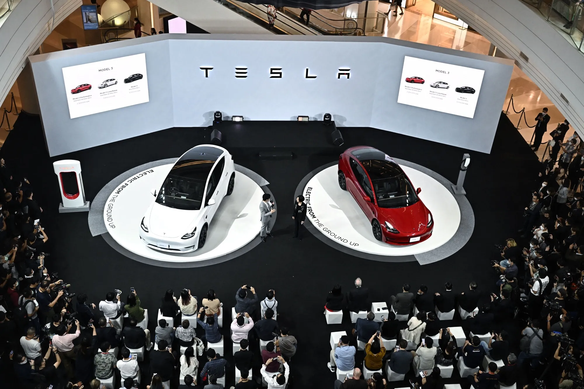 The Tesla Model Y, left, and Model 3 at a December launch event in Bangkok.