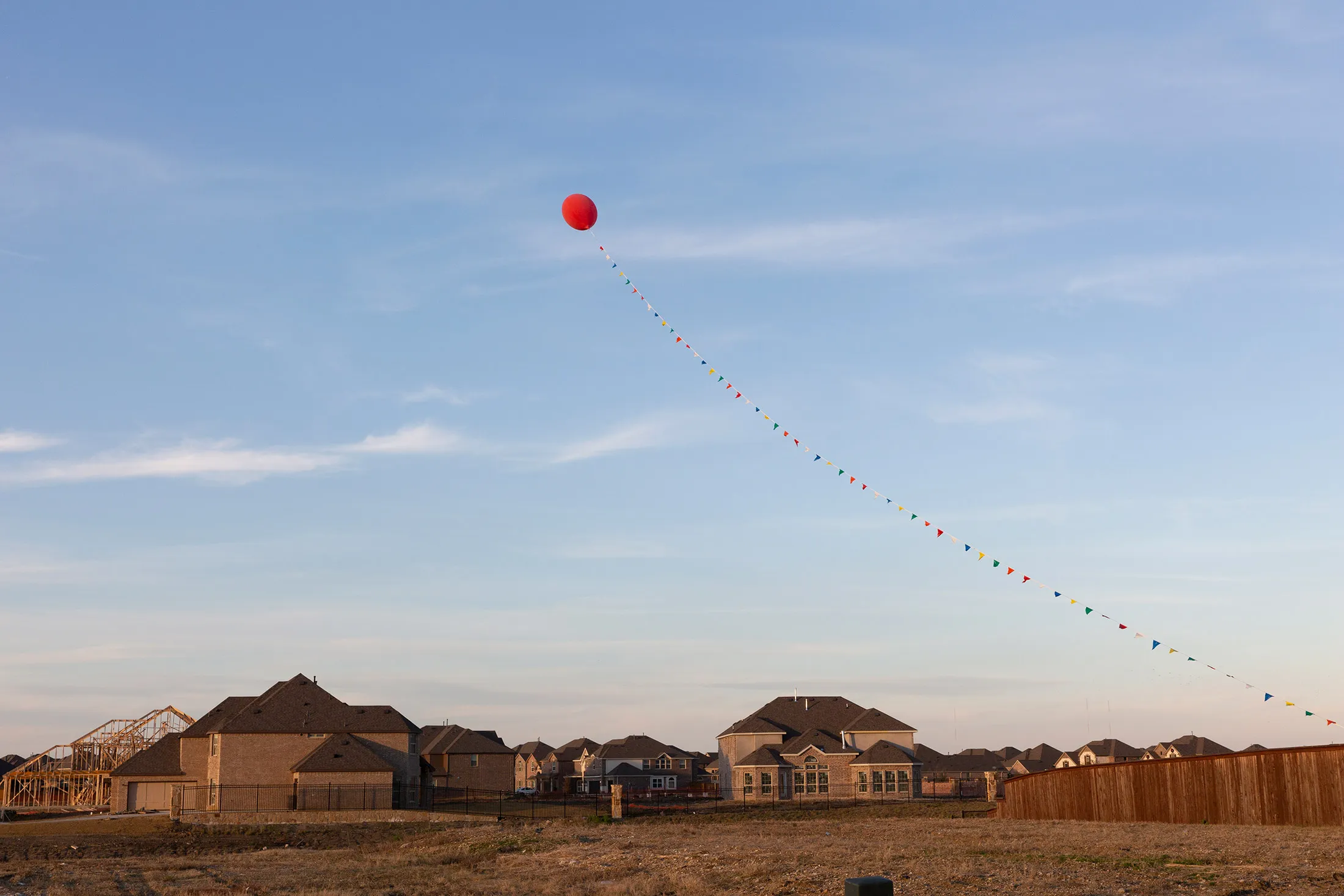 A large balloon floats over a sales office at Creeks of Legacy, a housing development&nbsp;in Prosper, Texas, on Nov. 17, 2018.