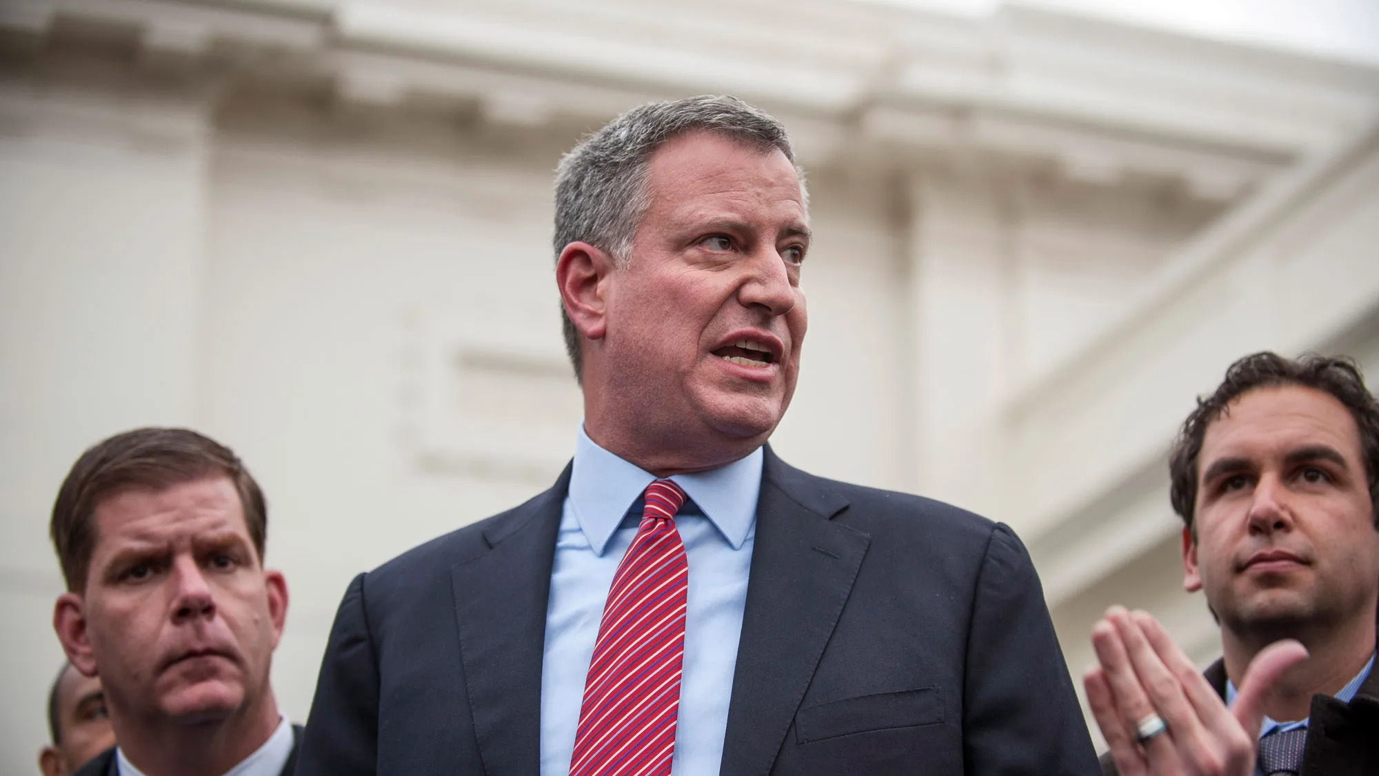 New York City mayor-elect Bill de Blasio and a group of newly-elected mayors from across the country speak to the media outside of the West Wing of the White House in Washington, D.C., U.S., on Friday, Dec. 13, 2013.
