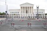 Metal fencing can’t keep politics out of the Supreme Court.