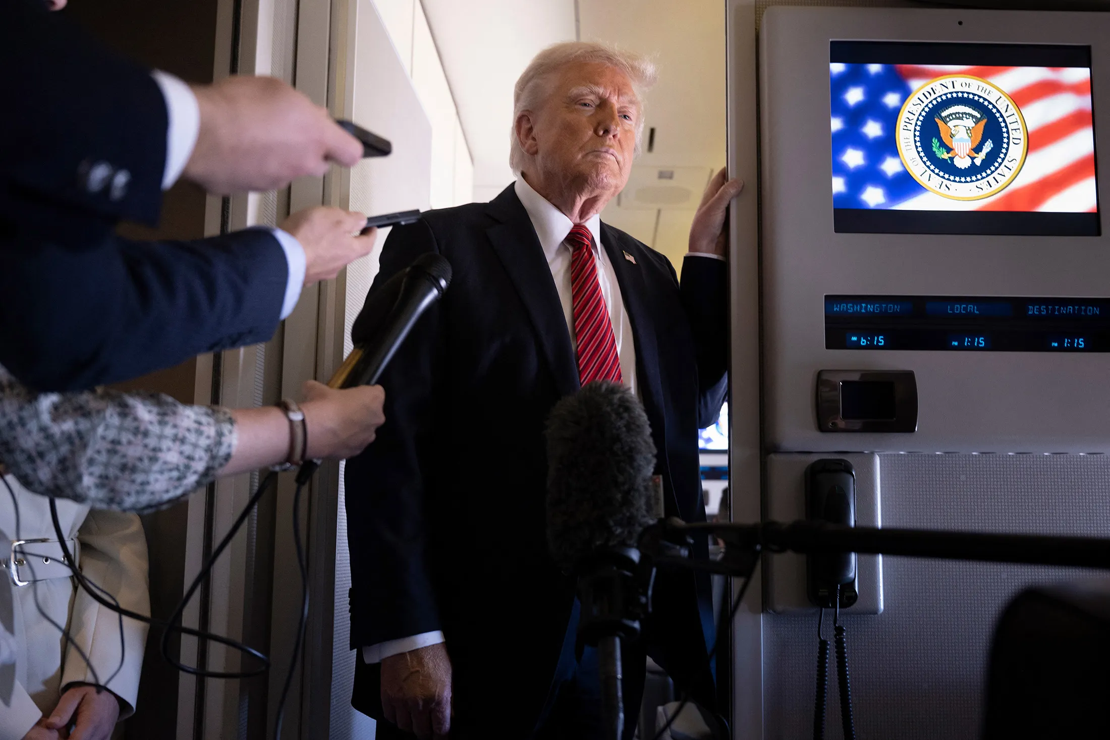 President Trump speaks to members of the media on Air Force One while flying to Qatar on May 14.