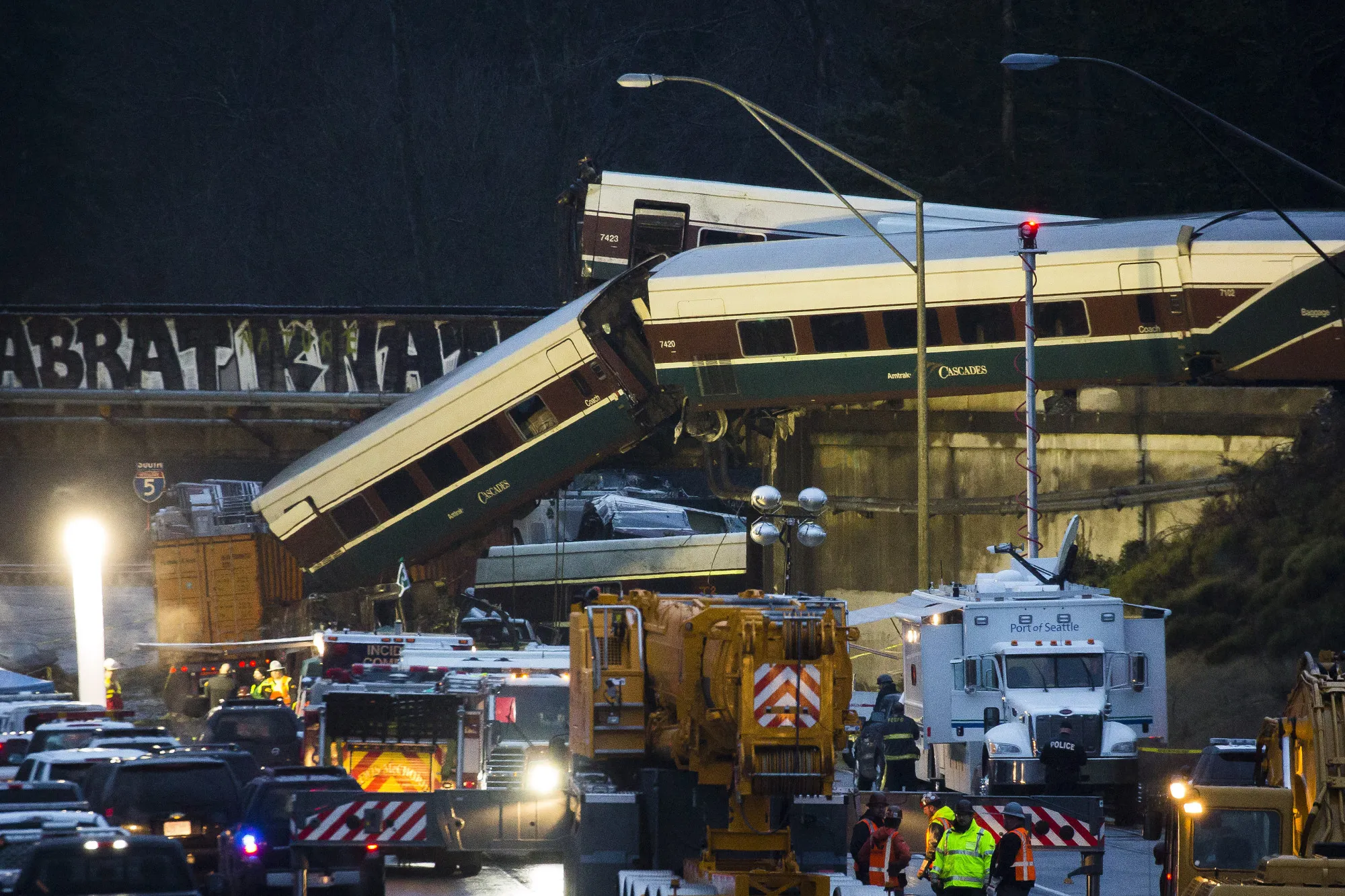 Amtrak train cars lie on Interstate 5 after a derailment in DuPont, Washington, U.S., on Monday, Dec. 18.