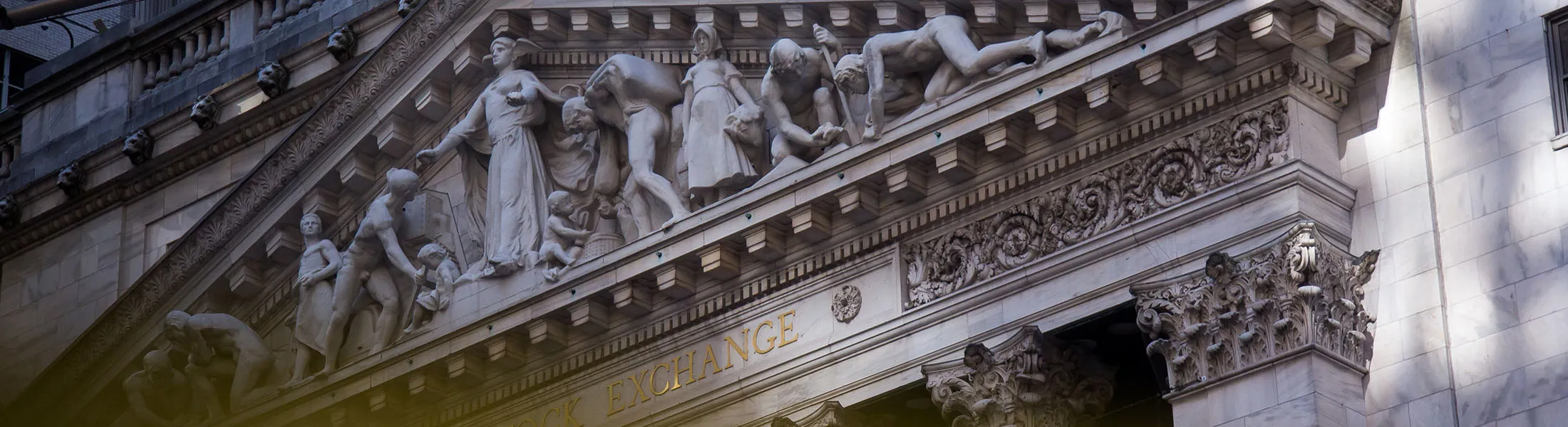The New York Stock Exchange (NYSE) stands in New York, U.S., on Friday, Oct. 27, 2017. Stocks climbed and the dollar rallied afterÂ the U.S. economyÂ saw its strongest back-to-back quarterly growth in three years, while bonds rose as speculation mounted about the next Federal Reserve chair.