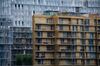 Faraday House residential apartments, right, stand next to Scott House, in the Circus West Village development of the Nine Elms district of London, U.K., on Wednesday, May 23, 2018. Traditional lenders are charging more for loans or declining to offer money at all after a boom in prime properties ended and left builders with a record number of homes without buyers.