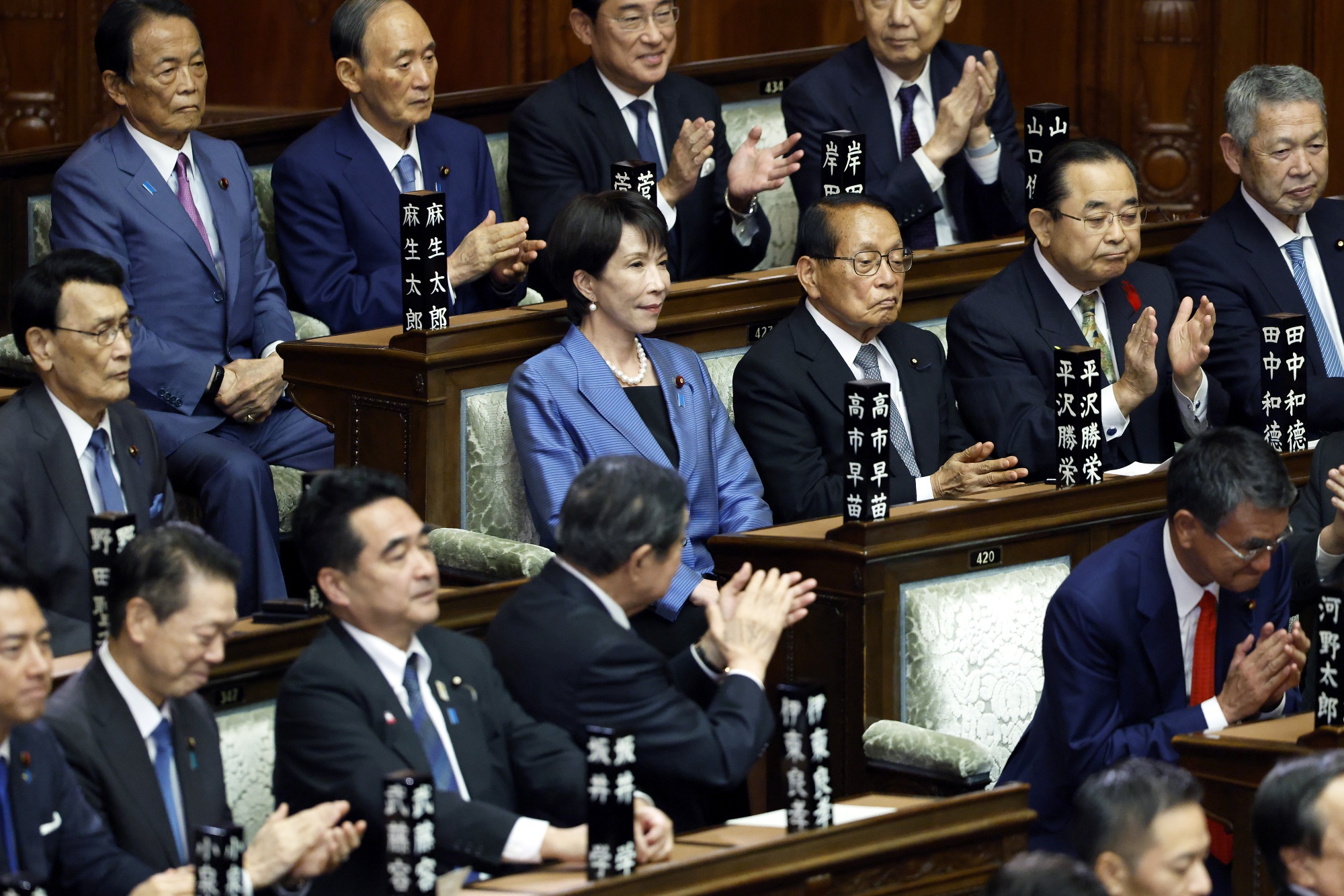 Sanae Takaichi, president of the Liberal Democratic Party, center, receives a round of applause during an extraordinary session at the lower house of parliament in Tokyo, Japan, on Tuesday, Oct. 21, 2025. Takaichi won the lower house of parliament vote to become Japan&#39;s prime minister on Tuesday, effectively making her the first woman to clinch the nations top presidentship job. Photographer: Kiyoshi Ota&#x2F;Bloomberg. Photographer: Kiyoshi Ota&#x2F;Bloomberg