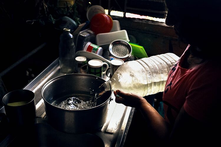 Aura Sarmiento boils her water twice every day for at least 15 minutes each time. She has to do it in the morning, so she can brush her teeth and cook breakfast.
