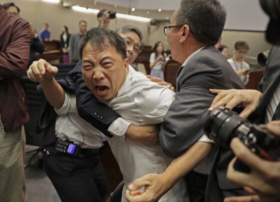 Hong Kong Lawmakers Told to Behave After Extradition Law Brawl