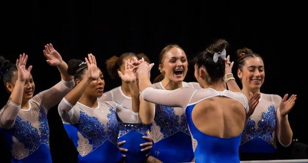 Savannah Schoenherr celebrates with her University of Florida teammates during the 2023 NCAA women’s gymnastics semifinals. Schoenherr received a $3,000 check from a company she’d arranged an NIL deal with but after she deposited it, the check bounced. 