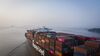 The Hapag-Lloyd AG Leverkusen Express sails out of the Yangshan Deepwater Port, operated by Shanghai International Port Group Co. (SIPG), in this aerial photograph taken in Shanghai, China, on Wednesday, Aug. 7, 2019. Trump's threat to raise tariffs on all Chinese goods last week shattered a truce reached with Xi just weeks earlier, unleashing tit-for-tat actions on trade and currency policy that risk accelerating a wider geopolitical fight between the world's biggest economies.