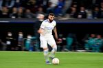 Real Madrid's French forward Karim Benzema runs with the ball during a UEFA Champions League match