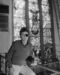 Gatien stands near one of the original stained glass windows of the former church that was transformed into the Limelight, Oct. 22, 1983.