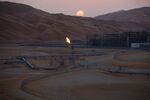 Flames burn off at an oil processing facility at Saudi Aramco's Shaybah oil field in the Rub' Al-Khali (Empty Quarter) desert in Shaybah, Saudi Arabia