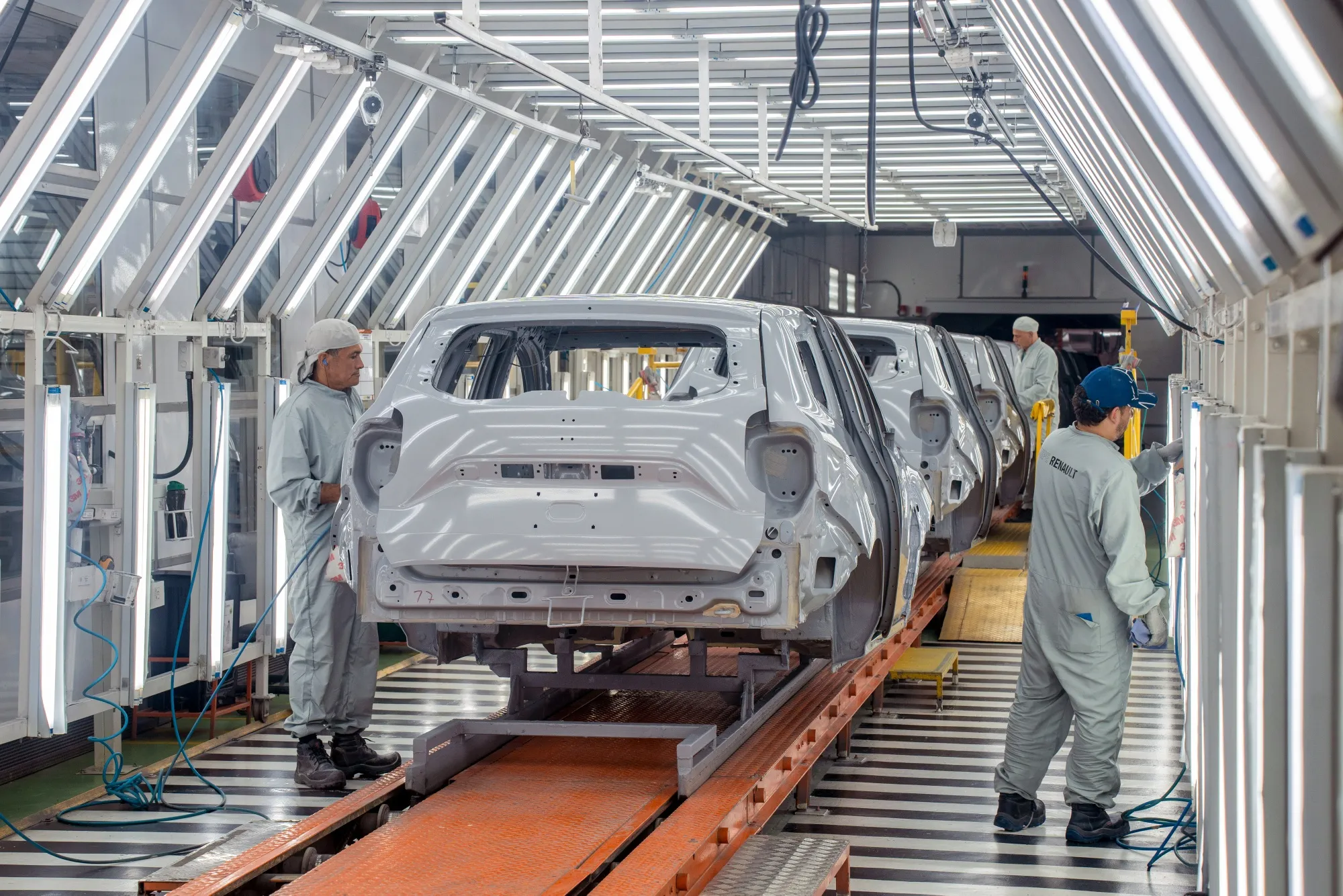 Workers prepare Renault SA vehicles for painting at the Renault-Sofasa Envigado Assembly Plant in Medellin, Colombia.