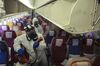 Workers in protective suits spray inside an aircraft during a disinfection process in Thailand on Jan. 28.